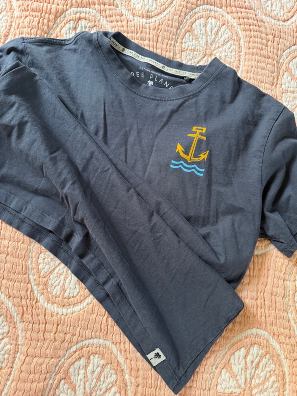 Free Planet Navy Short Sleeve Tee with Yellow Anchor and Blue Waves